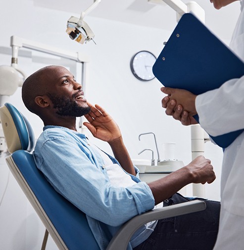 Man smiling at the dentist